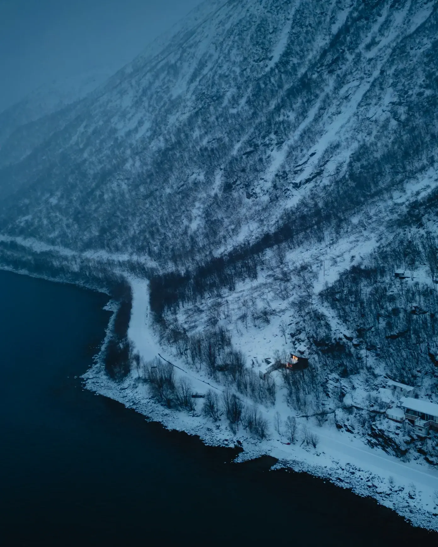 A couple dancing in a cosy cabin